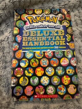 Scholastic Pokémon Deluxe Essential Handbook – Blue & Multicolor Character Cover